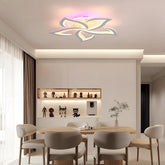 Modern dining room with a stylish ceiling light fixture.